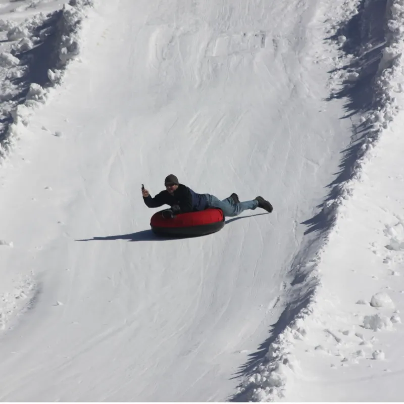 a man riding skis down a snow covered slope