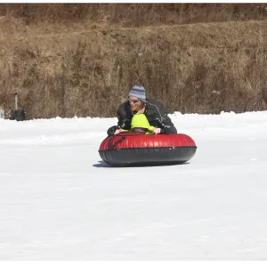 a person riding skis down a snow covered field