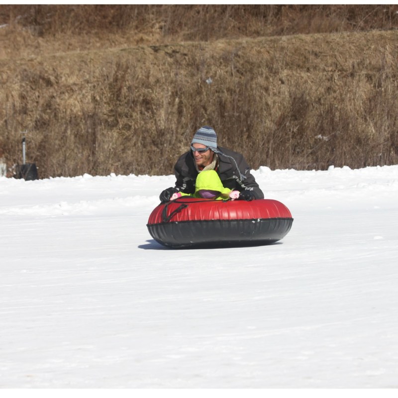 a person riding skis down a snow covered field