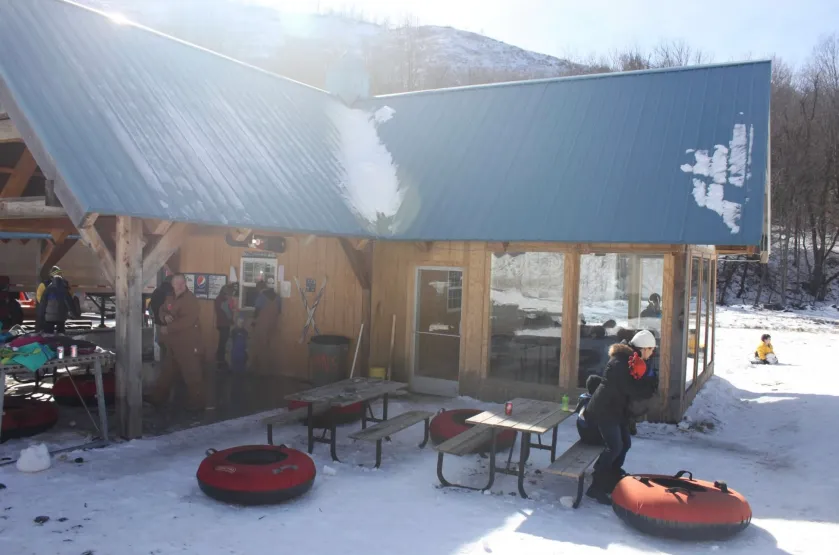 a group of people sitting in chairs in front of a building