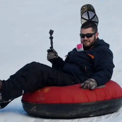 a man holding a snow board