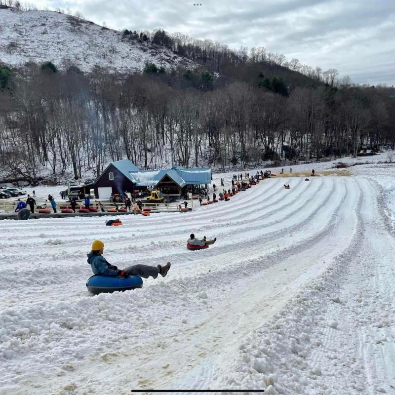 a group of people walking in the snow